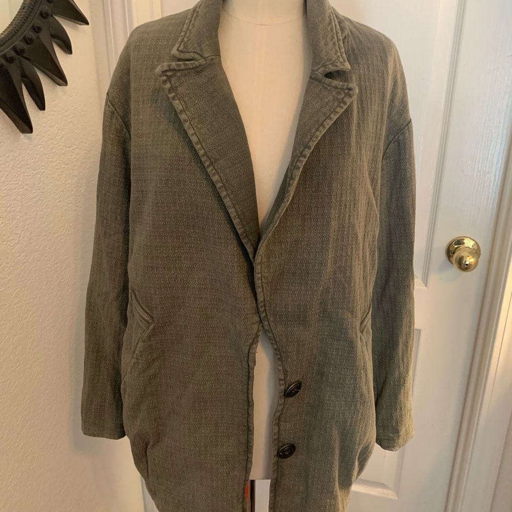 Free people army green color jacket with hood.